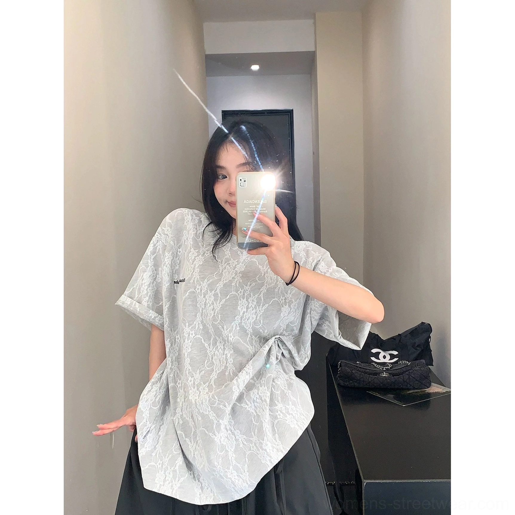 Grey frosted vein lace texture oversized streetwear t-shirt shown from the side with a loose draped silhouette