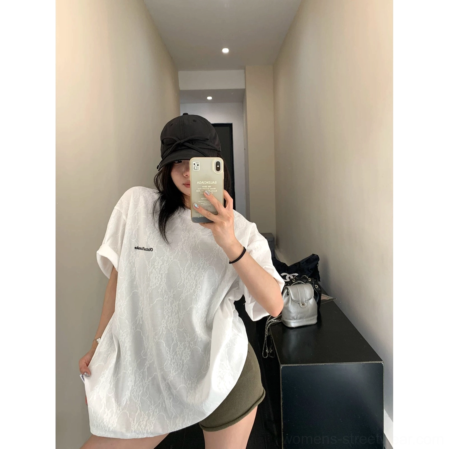 White lace-effect oversized streetwear t-shirt with relaxed short sleeves styled with olive shorts