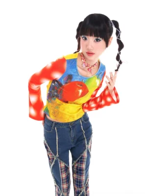 Front view of fitted fruity pop cropped blouse with pixel apple graphic, crew neckline, and dramatic red flared sleeves