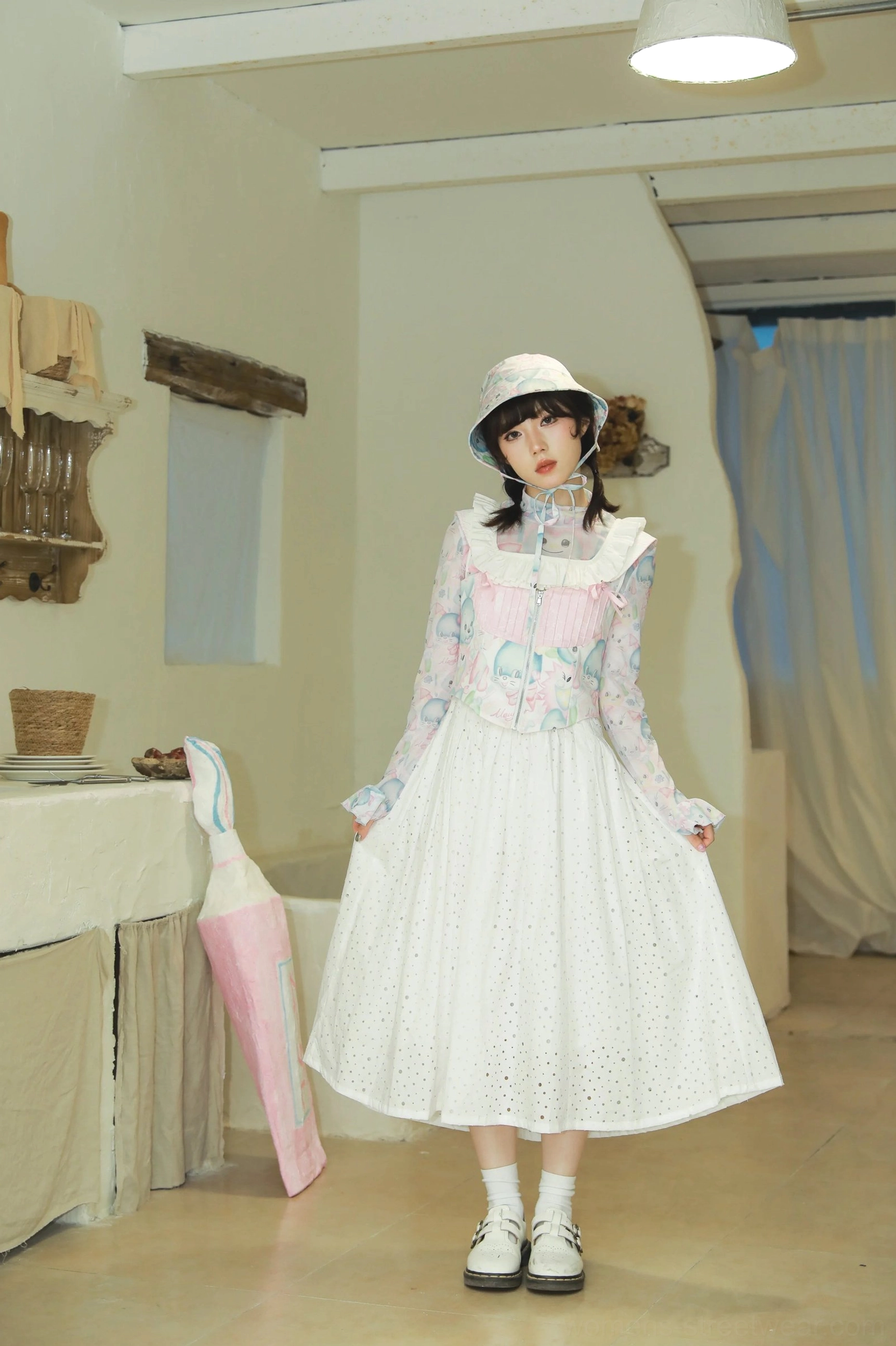Full bunny print corset outfit styled with mesh top bucket hat ruffled skirt loafers and socks in a cute Y2K fashion look