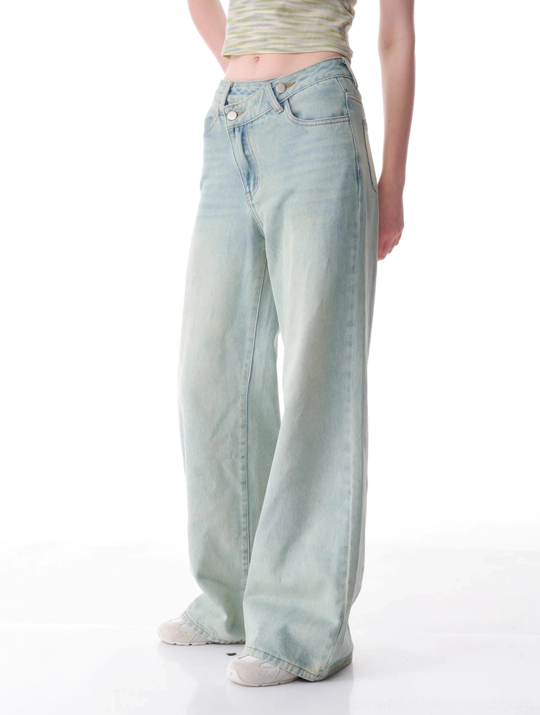 Full-length product view of asymmetrical light wash wide leg jeans with relaxed Korean streetwear styling