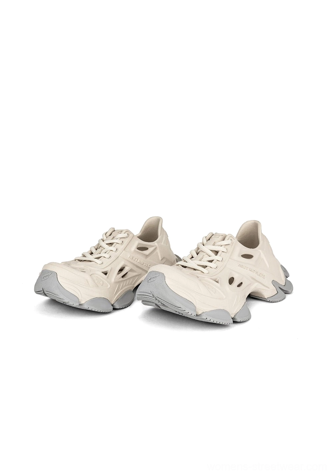 Pair of off-white futuristic EVA platform clogs with ventilated side panels and chunky streetwear sole