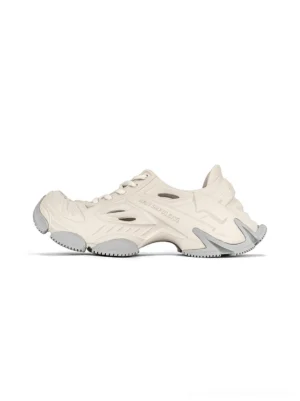 Off-white futuristic EVA platform clogs with ventilated side panels, lace-up front, and chunky grey streetwear outsole
