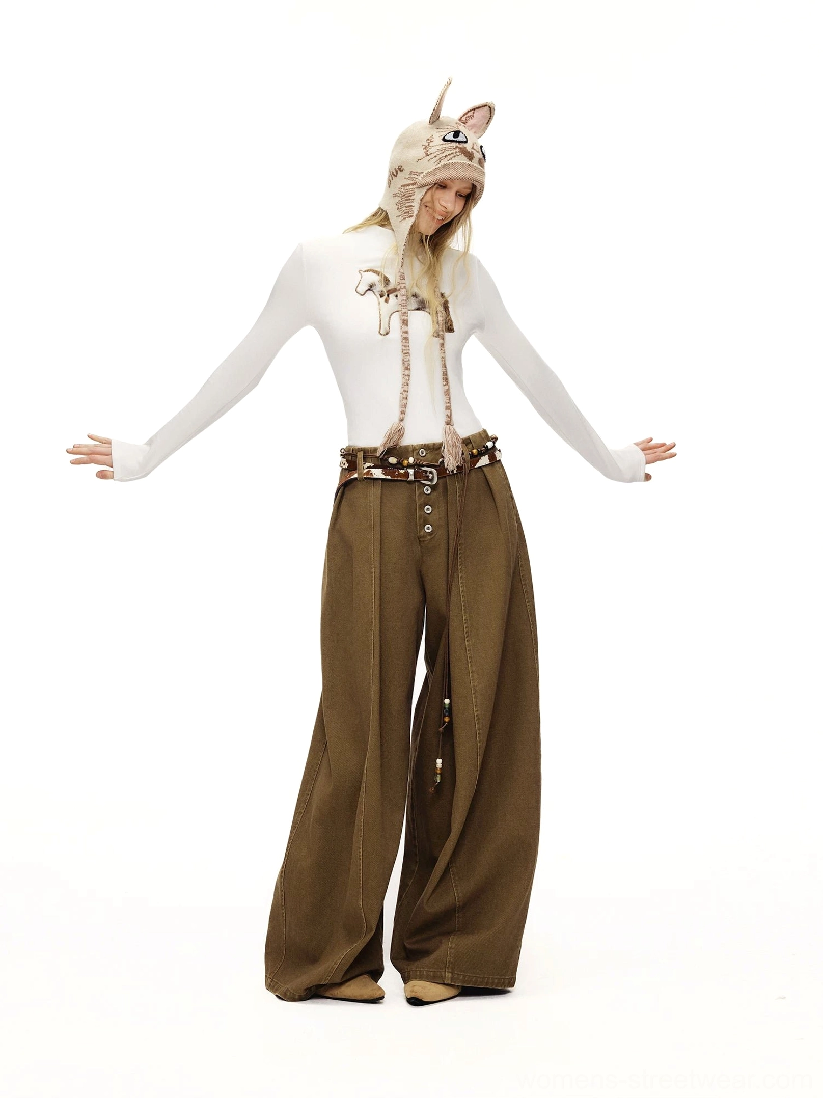White fitted fuzzy cat mock neck long sleeve tee styled with brown wide-leg trousers and a cat ear knit hat