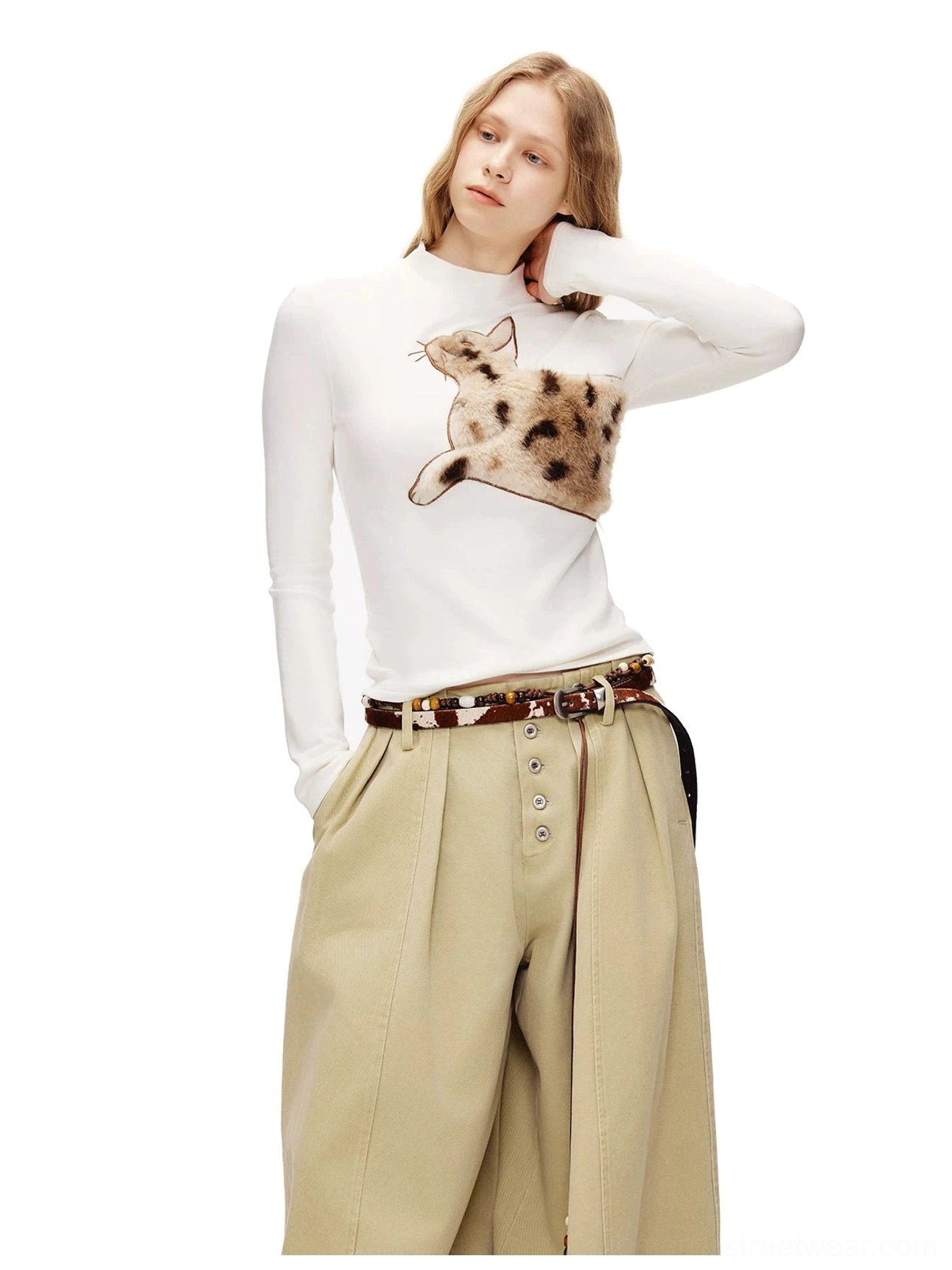 White slim-fit fuzzy spotted cat long sleeve streetwear top styled with relaxed khaki trousers