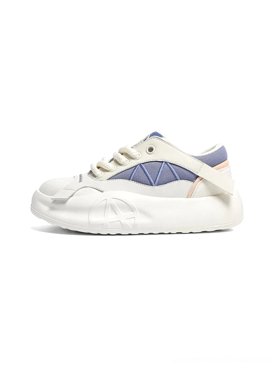 Blue geometric panel platform runner sneaker shown from the left side on a white background, with a cream chunky sole and rounded toe