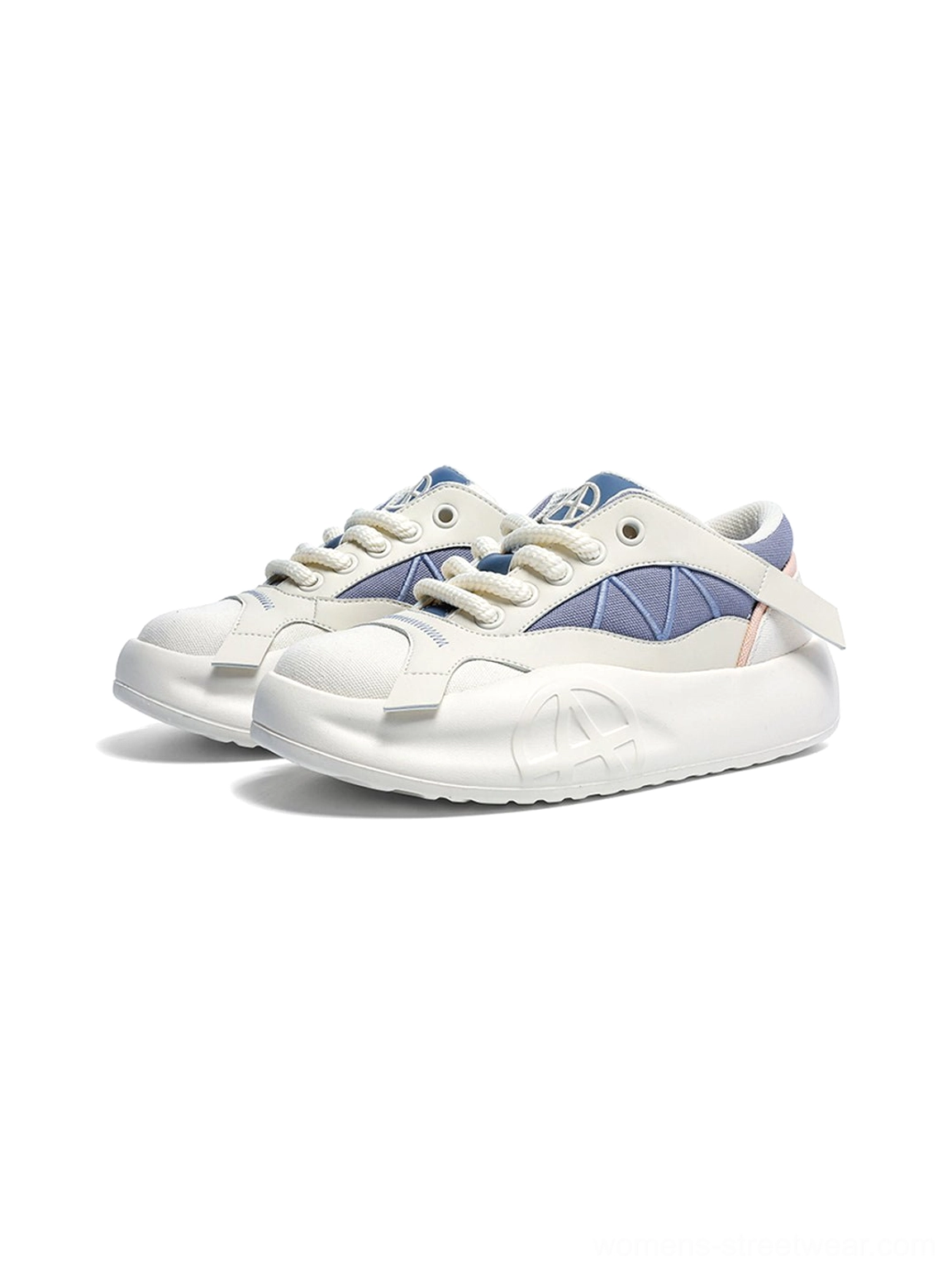 Pair of geometric panel platform runner sneakers on a white background, viewed from above with blue side panels and cream uppers visible