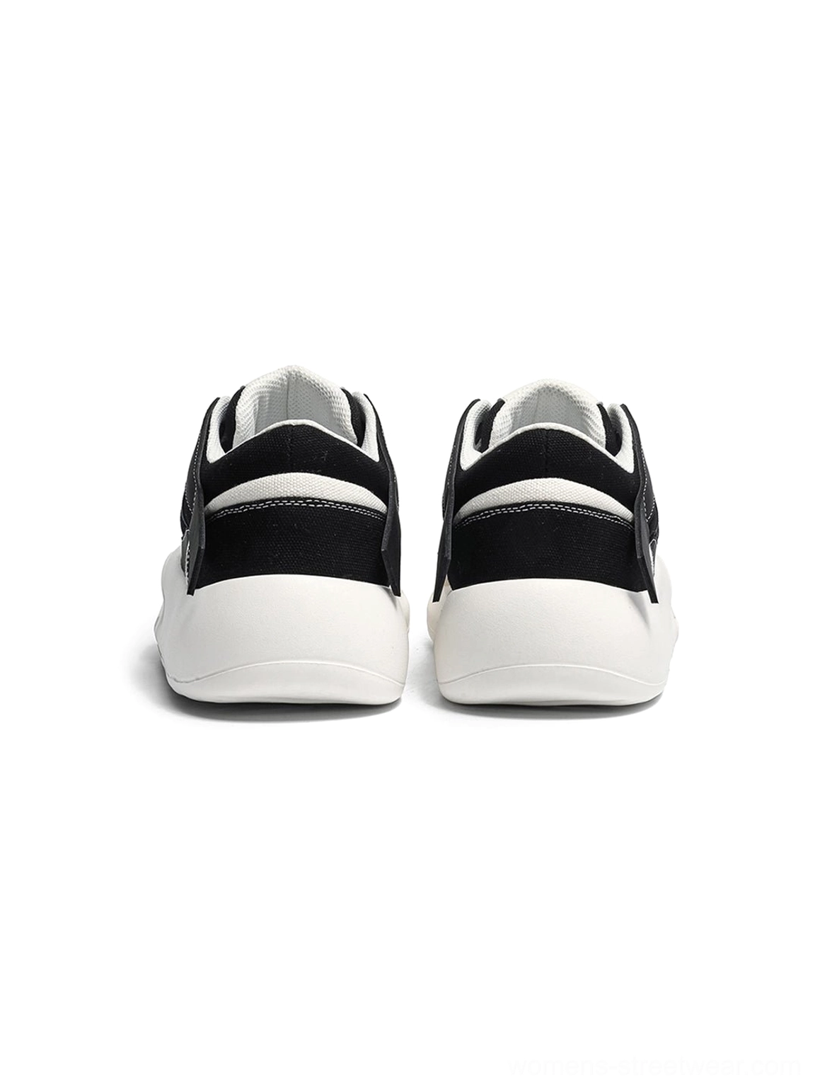 Product image of geometric panel platform runner sneakers with a mixed synthetic and textile upper