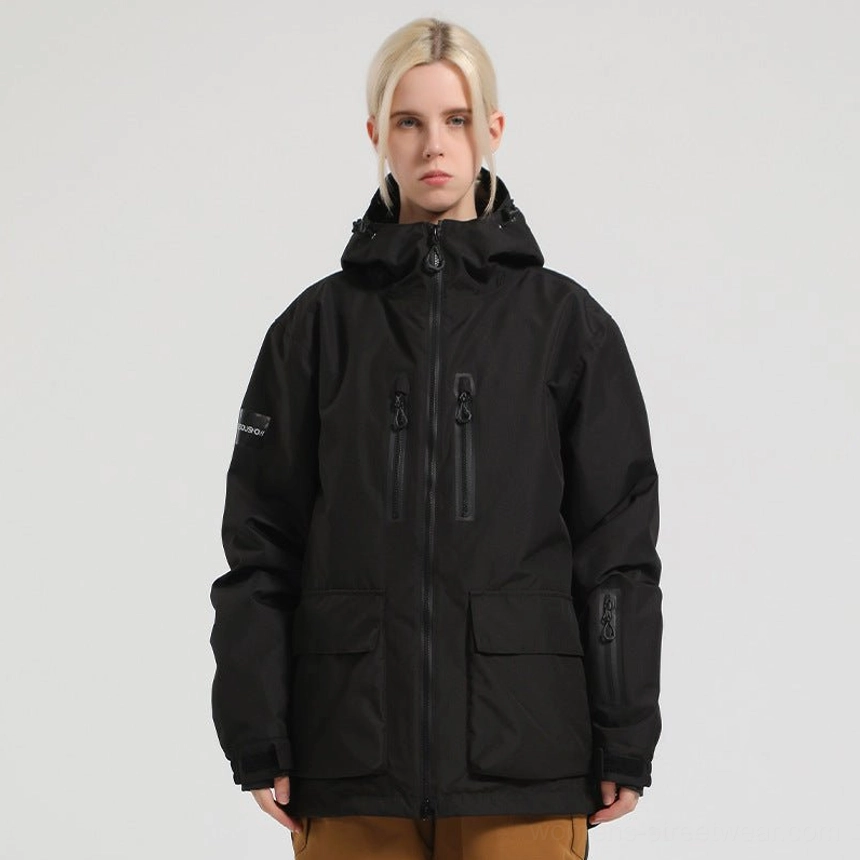 Matte black Glacier Drift unisex hooded snowboard jacket with dual chest zip pockets large cargo pockets and sleeve utility patch