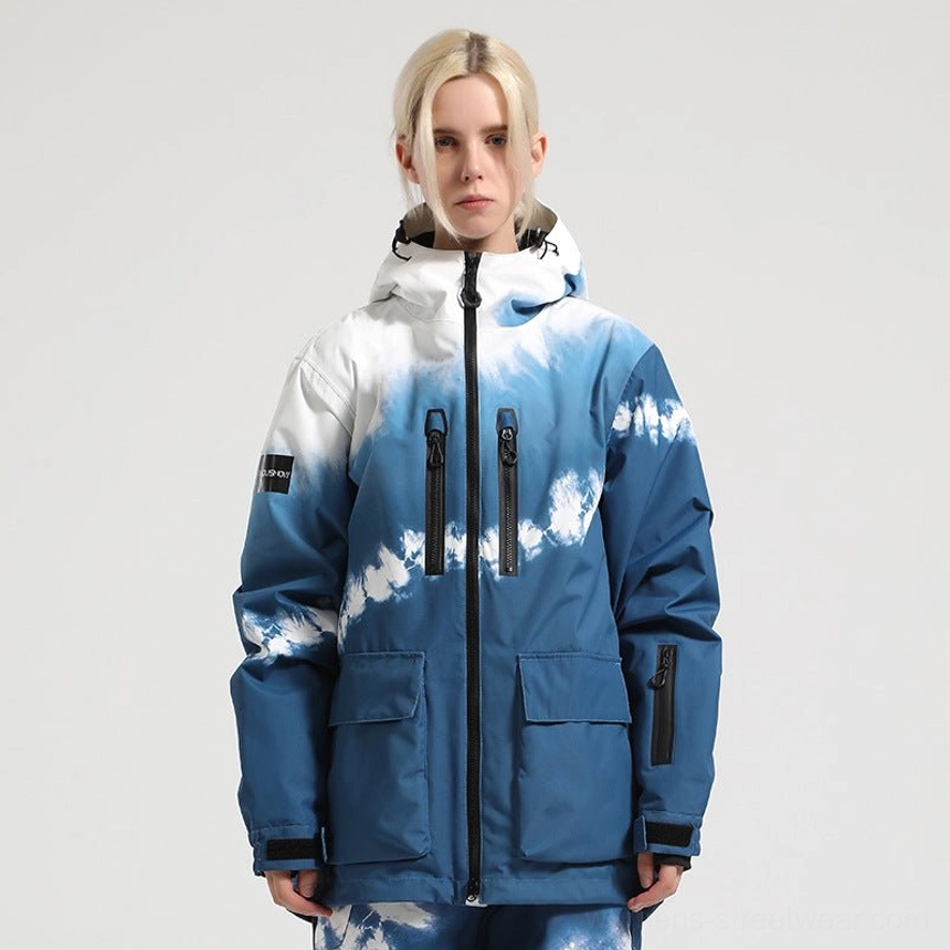 Blue and white cloud print Glacier Drift hooded snow jacket styled with matching snow pants for a coordinated techwear ski outfit