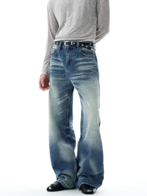 Full-body front view showing heavily washed blue flare-leg jeans with an oversized bell-bottom silhouette and vintage streetwear styling