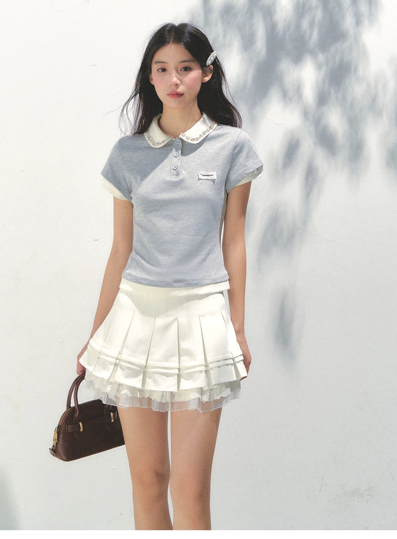 Glass blue lace collar cotton polo top with contrast white collar and cuffs shown in side front view