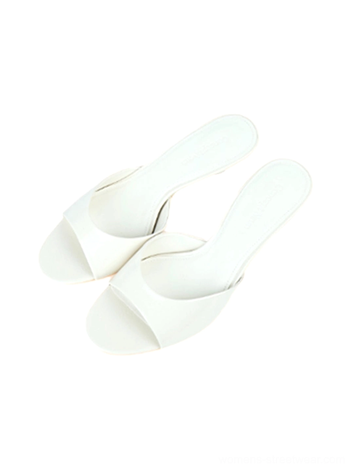Glossy open-toe kitten-heel mules showing the slim upper and elegant tapered heel design