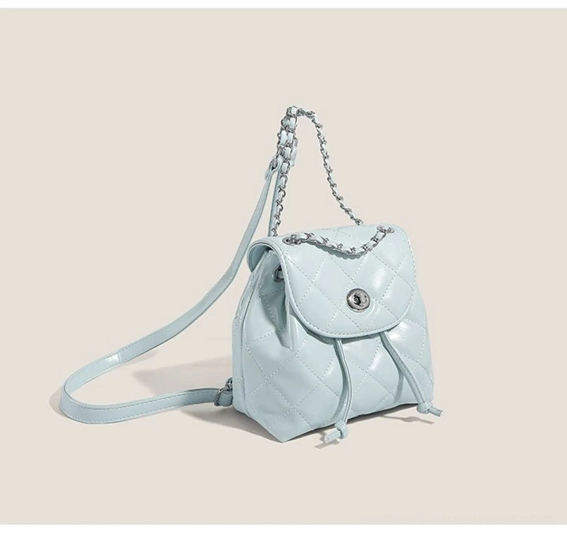 Sky blue quilted chain mini backpack with glossy PU finish and silver hardware side view
