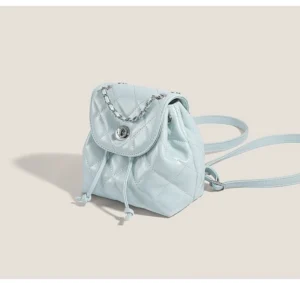 Sky blue glossy quilted chain mini backpack for Korean streetwear shown in three quarter front view