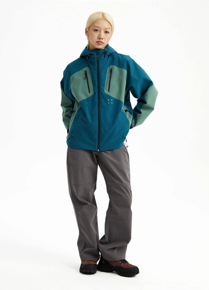 Gorpcore outdoor hooded jacket with full front zipper, chest pockets, and adjustable hem details