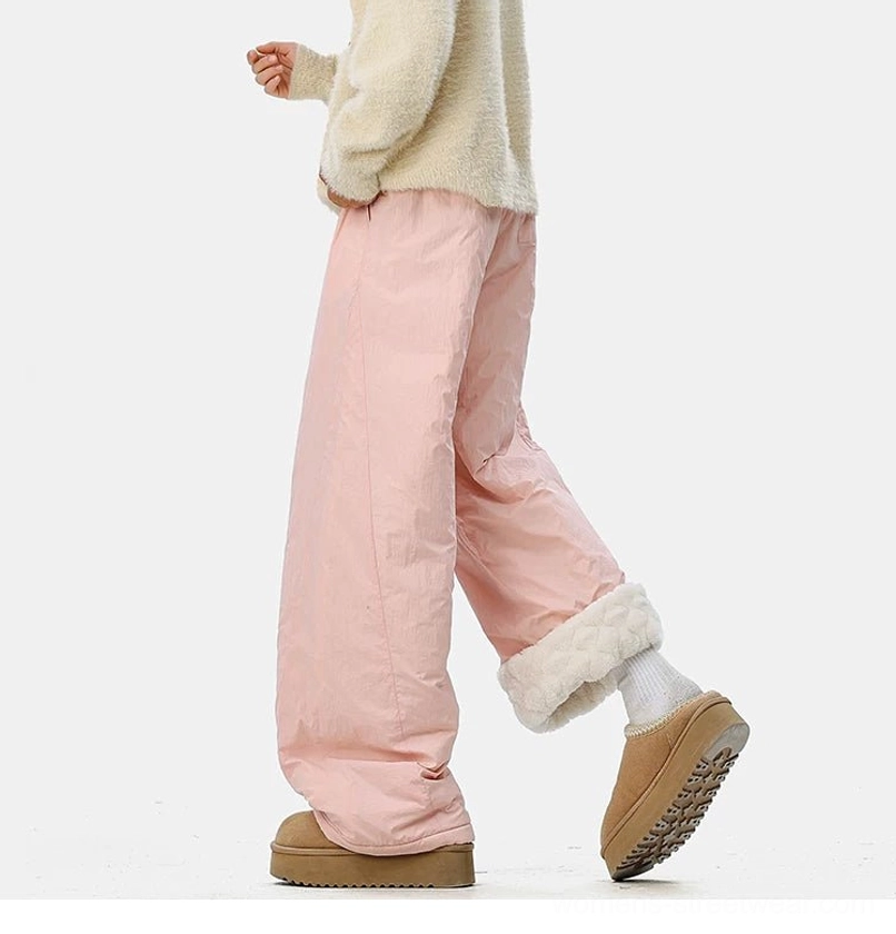 Gorpcore winter pants with crinkled polyester exterior, insulated fleece lining, and a comfortable wide-leg silhouette