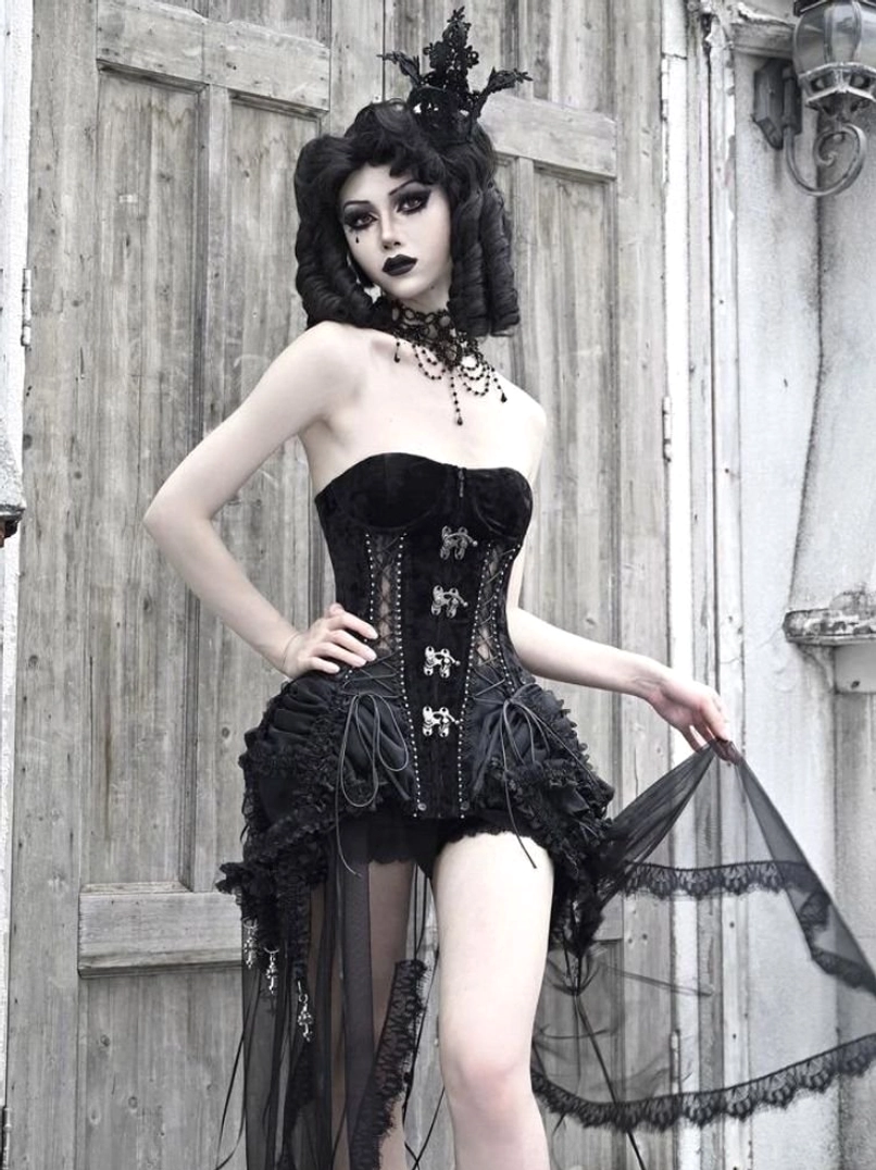 Three-quarter side view of gothic birdcage corset set showing black metal bodice details asymmetric ruffles and sheer drapes