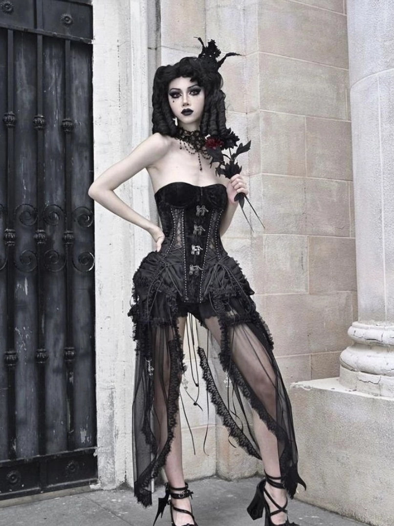 Full side view of strapless gothic birdcage corset set with structured black bodice and layered sheer mesh tulle skirt