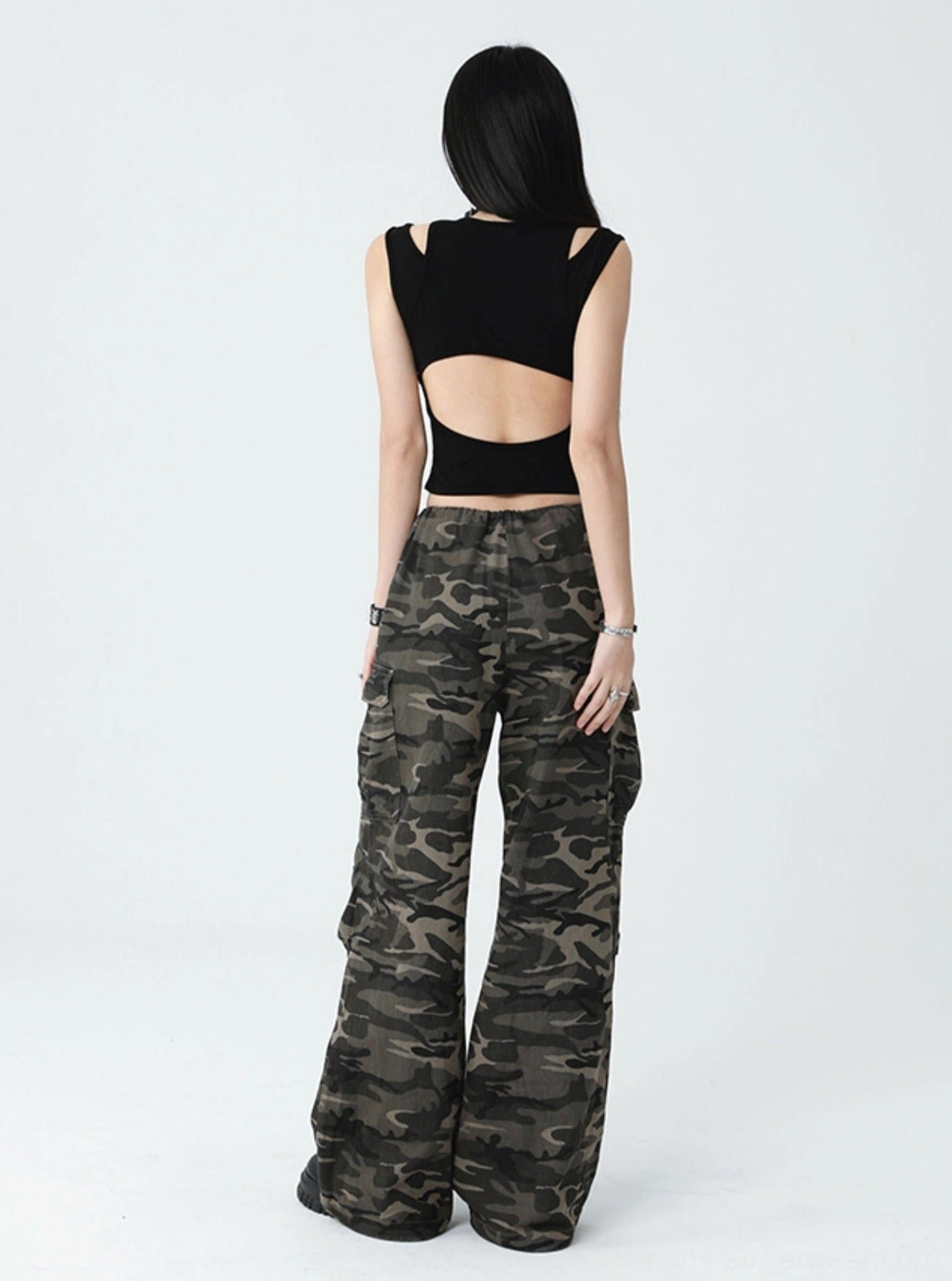 Gothic black cross cutout tank top with cropped waist-length fit, textured ribbed fabric, and versatile Y2K streetwear styling