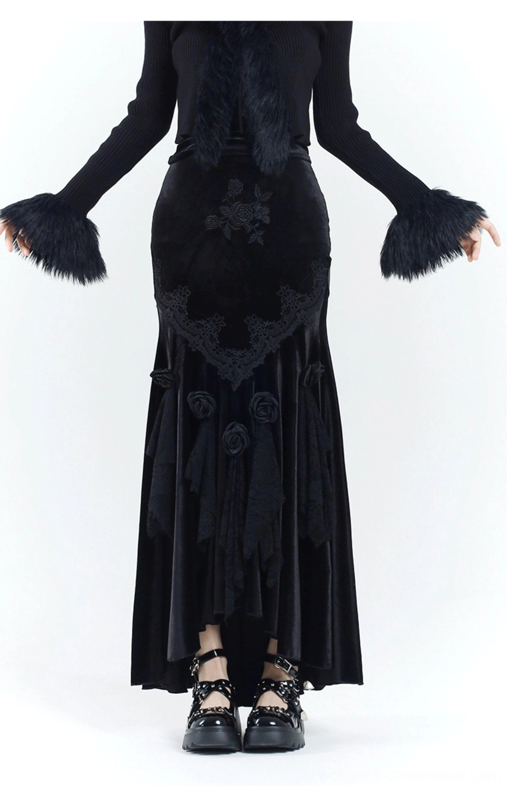 Front view of a gothic black velvet fishtail dress with mermaid silhouette, lace waist panels, embroidered details, and dimensional rose embellishments