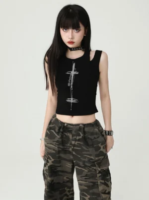 Black gothic cross cutout cropped tank top shown from the front with ribbed fabric, shoulder cutouts, silver cross graphic, and punk streetwear styling