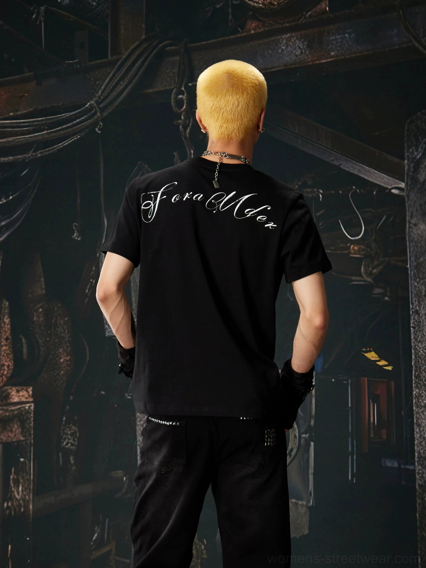 Black Gothic cross script graphic streetwear T-shirt back view showing handwritten script print across shoulders