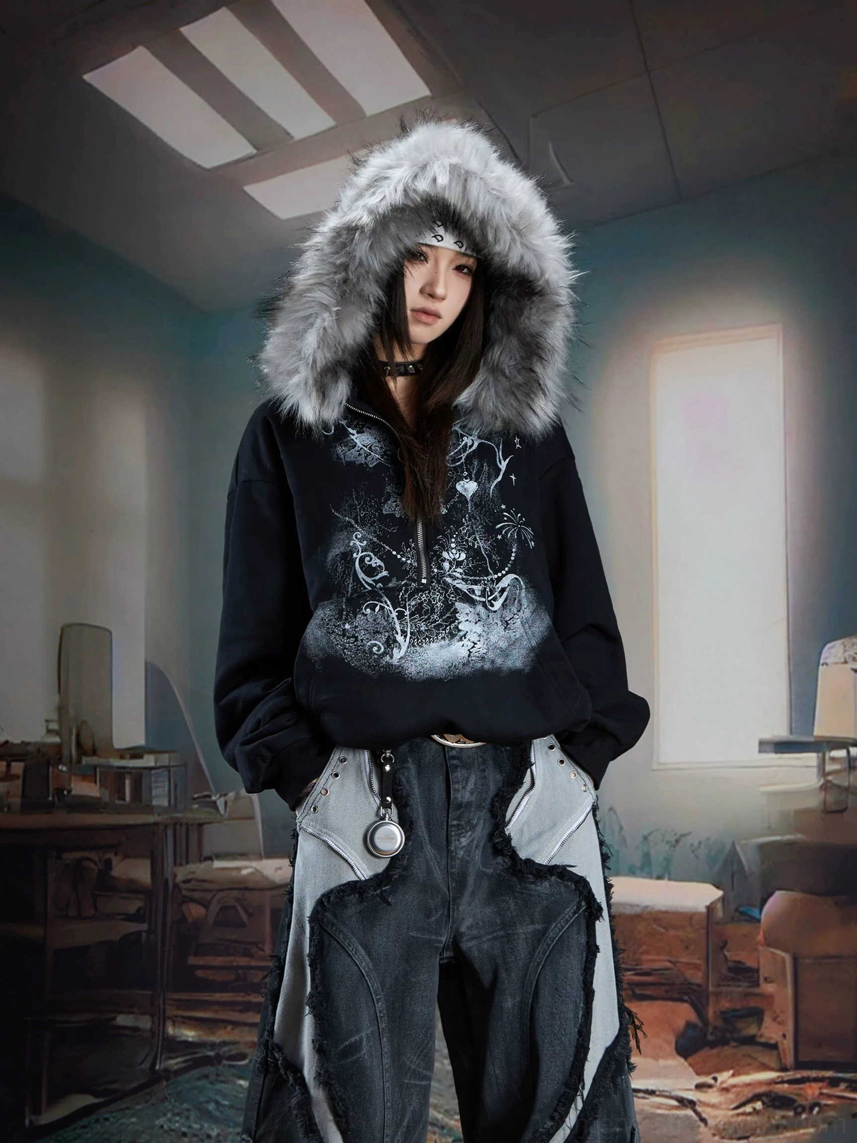 Black gothic faux fur trim graphic zip hoodie styled with patchwork cargo denim in a dim vintage room