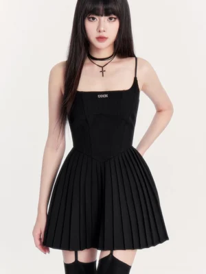 Black gothic pleated cami mini dress with square neckline fitted corset bodice and flared skirt styled with thigh-high stockings