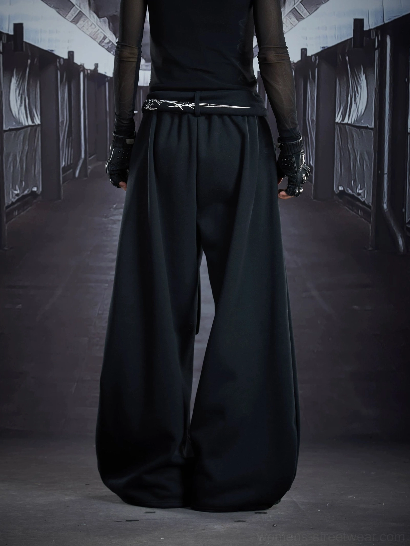 Back view of black gothic sigil drape streetwear cargo sweatpants with oversized wide legs and elastic waist belt detail