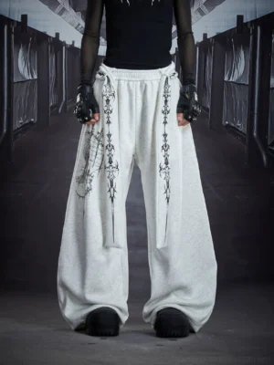 Light gray gothic sigil drape streetwear cargo sweatpants front view with oversized wide leg silhouette and hanging cross strap details