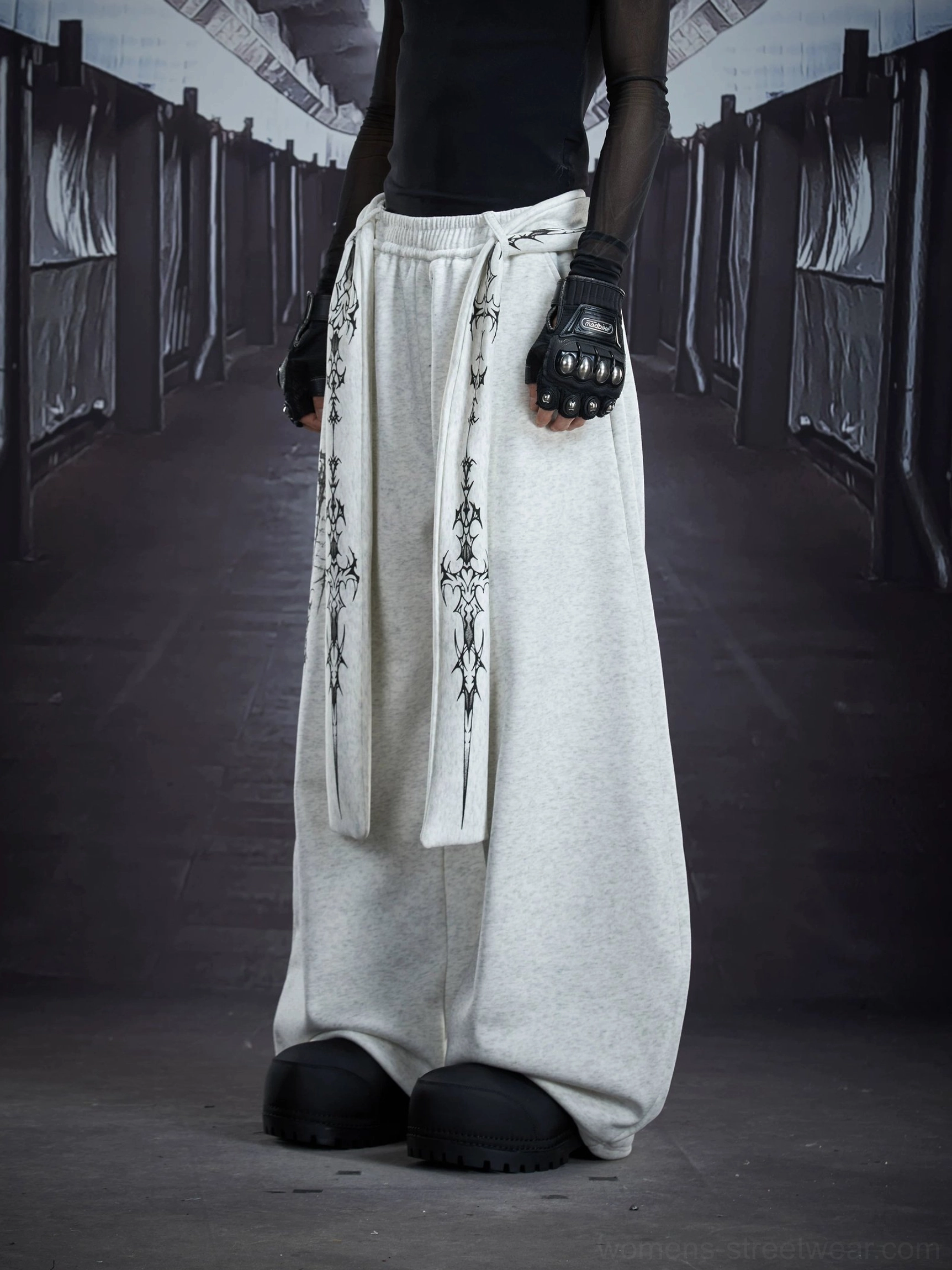 Side view of light gray oversized gothic sigil drape streetwear cargo sweatpants showing elastic waist and attached embroidered sash