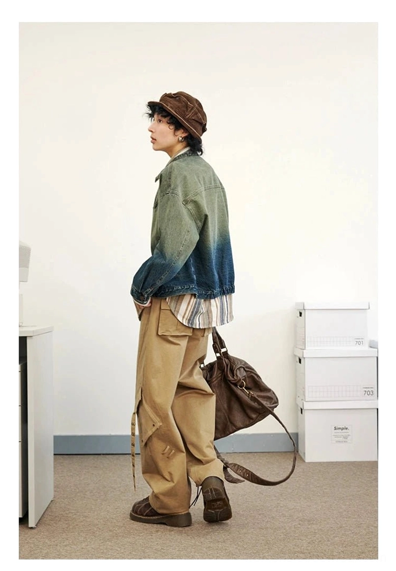 Blue green gradient washed denim flight jacket styled with khaki cargo pants side view