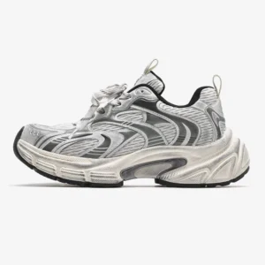 Granite Wave silver trail sneakers in antique gun grey with layered mesh upper, chunky off-white sole, heel pull tab, and distressed metallic streetwear design shown in a left profile studio view