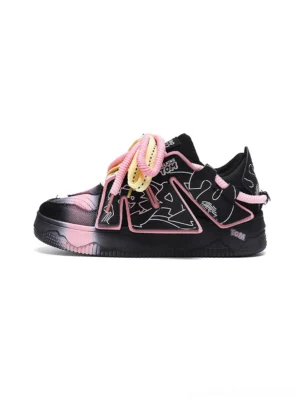 Black and pink graphic chunky low-top sneakers with gradient toe caps, colorful graffiti overlays, and thick contrast laces