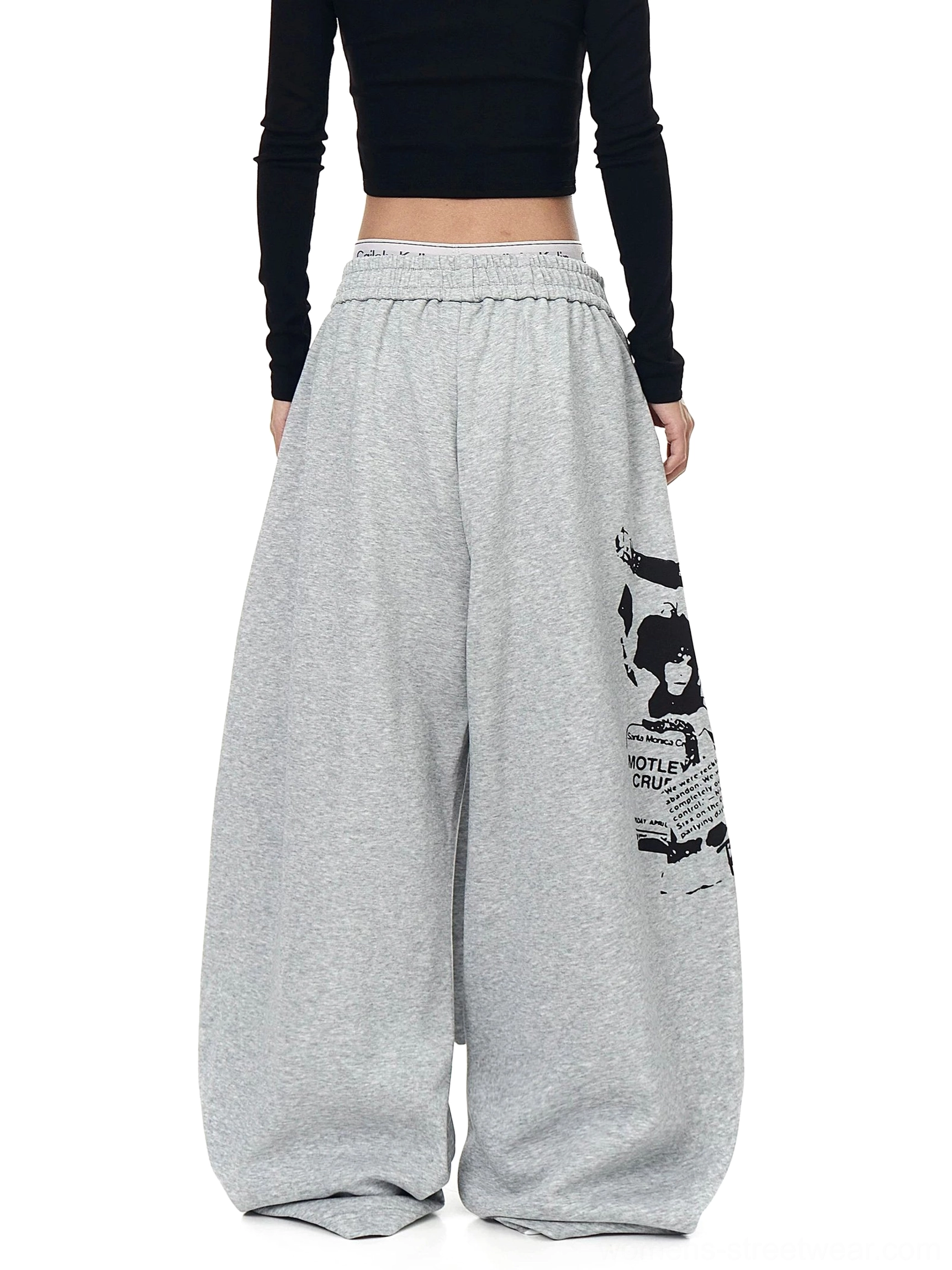 Heather gray oversized fleece wide leg streetwear sweatpants with small graphic print and relaxed elastic waist