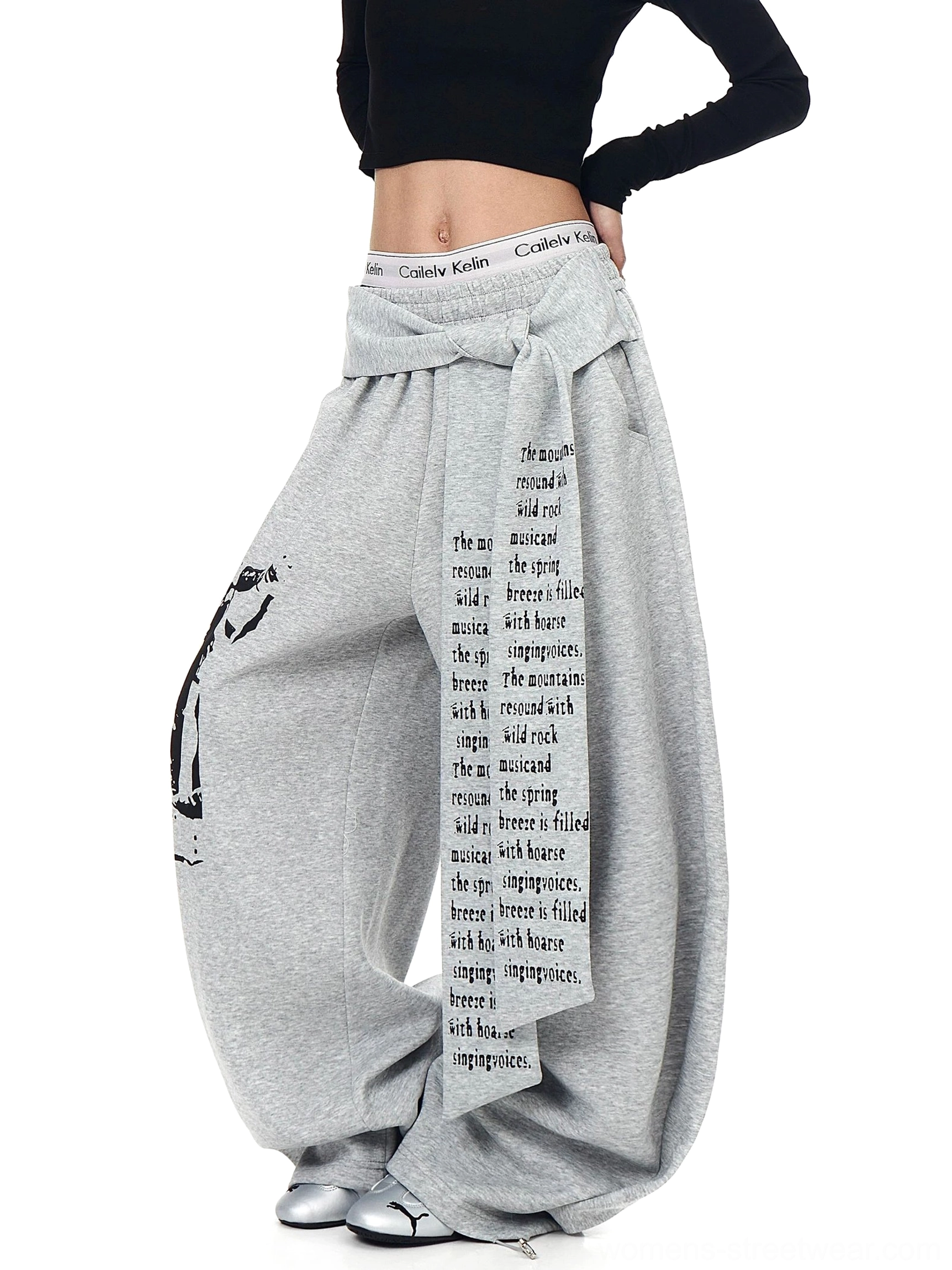 Side view of heather gray ultra wide leg graphic streetwear sweatpants with waist wrap panel