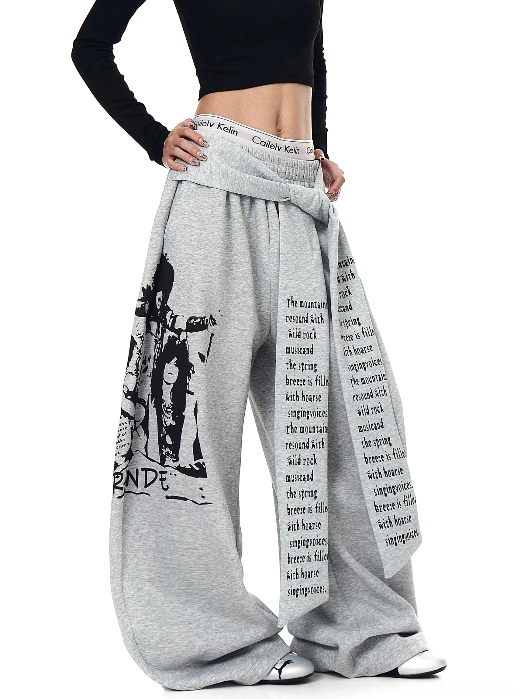 Heather gray ultra wide leg graphic streetwear sweatpants with wrap panel shown from three quarter front view