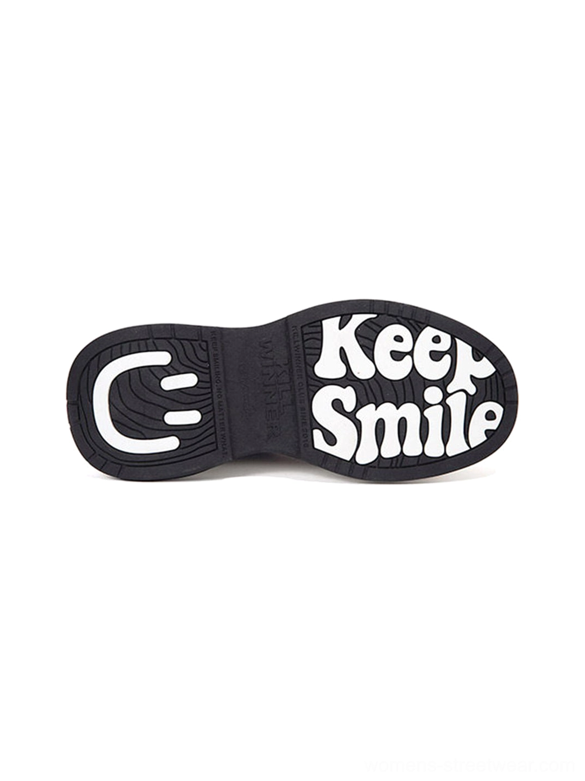 Close-up view of the black outsole on gray 7 cm platform sneakers featuring Keep Smile slogan and smiley logo graphic