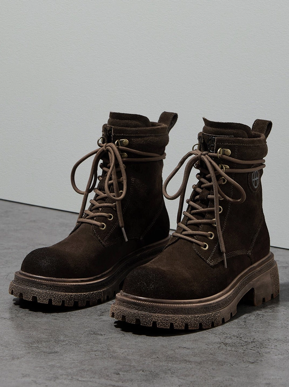 Gray and brown distressed combat boots side profile comparison showing silhouette consistency across color variants