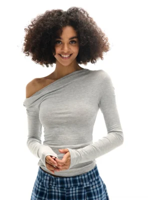 Gray asymmetric off-shoulder ruched thumbhole long sleeve top shown in a front full-body Korean streetwear look