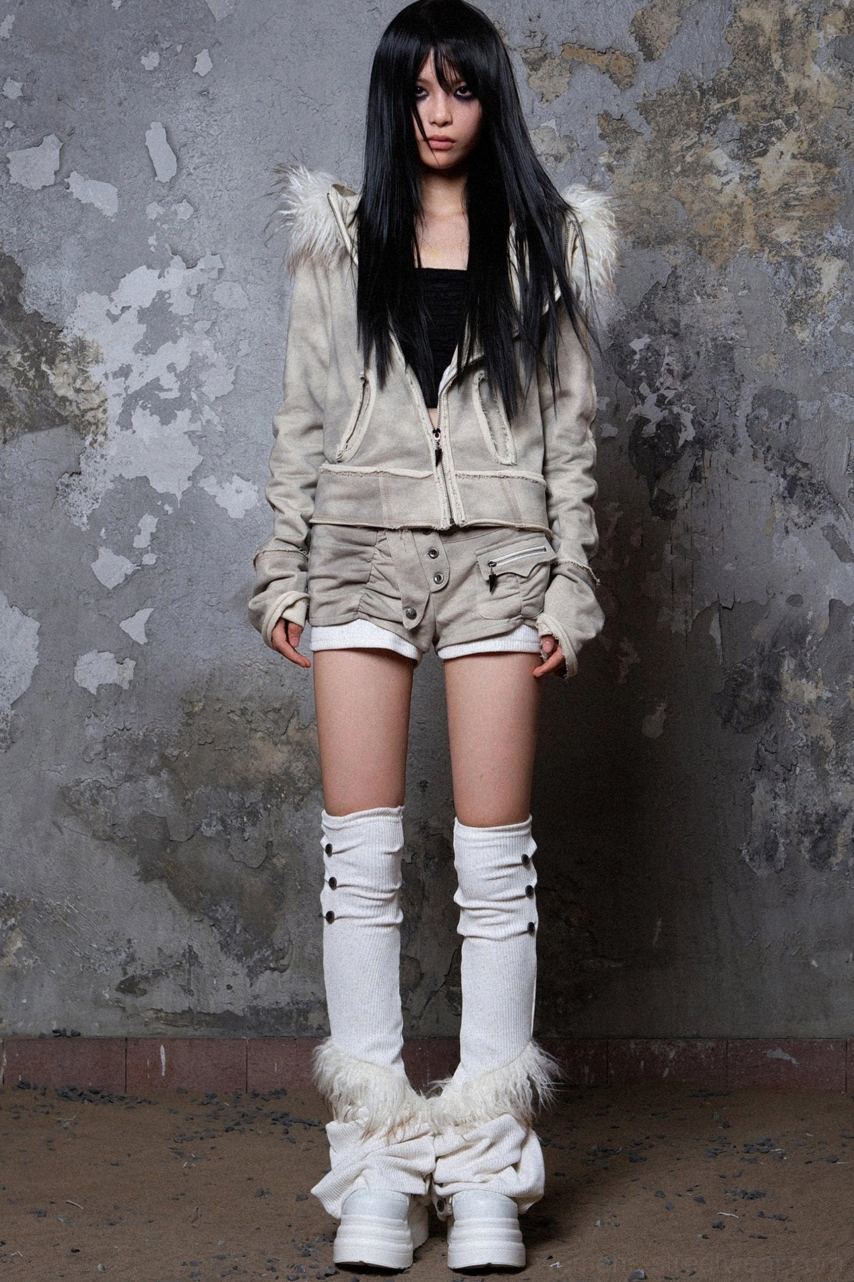 Gray asymmetrical faux fur hooded jacket product image with deconstructed raw-edge seams and winter streetwear styling