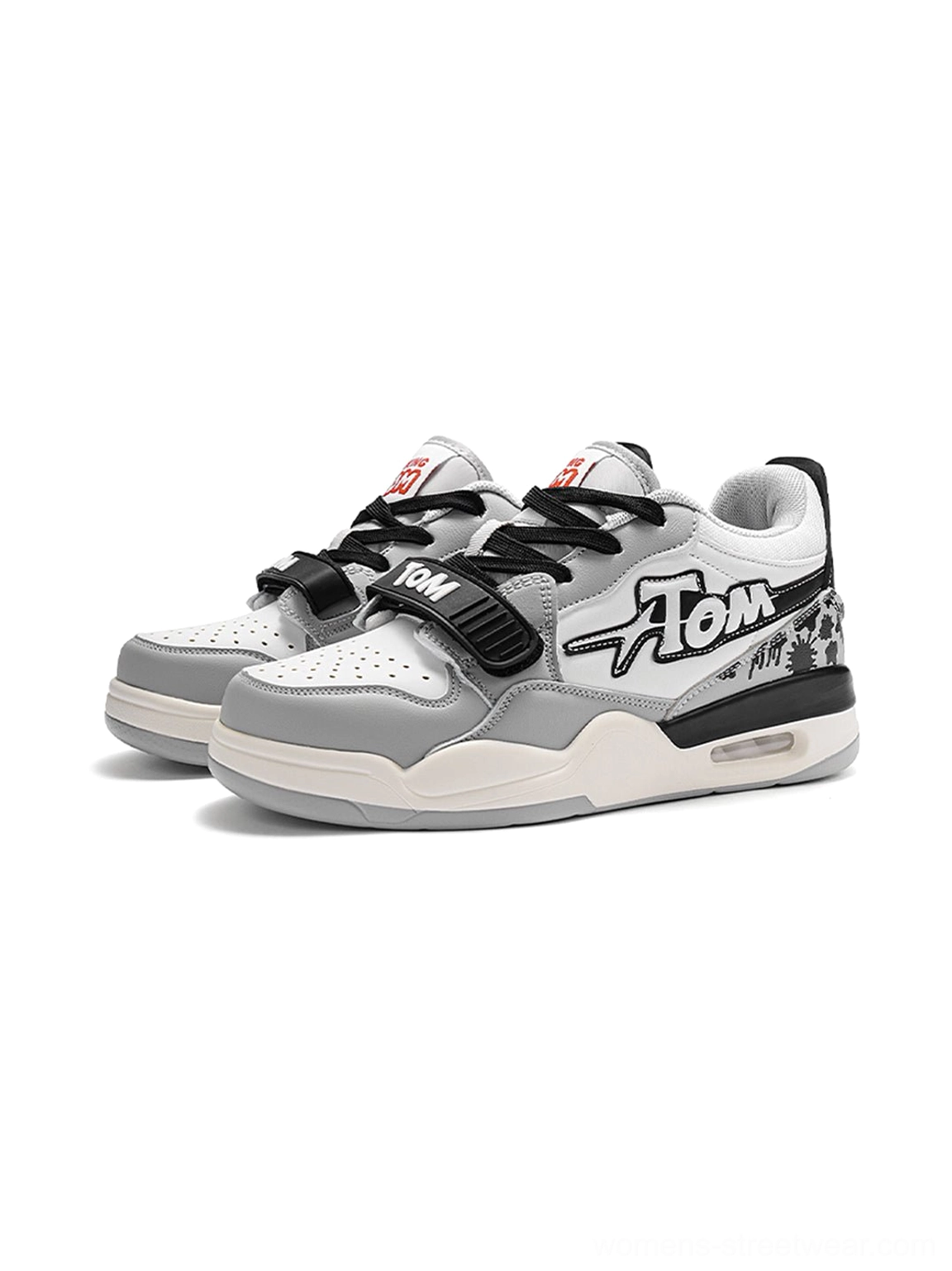 Gray black and white colorblock basketball-inspired court sneakers with black laces, adjustable strap, graphic side lettering, and cushioned outsole