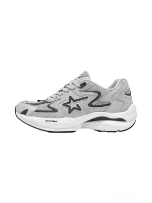 Gray carbon plate platform running sneakers in left side profile with layered suede mesh upper sculpted white technical sole and dark star side detail
