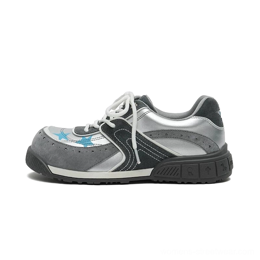 Standalone gray silver and dark charcoal star panel platform sneakers with layered faux leather and mesh upper, blue star accents, and chunky platform sole