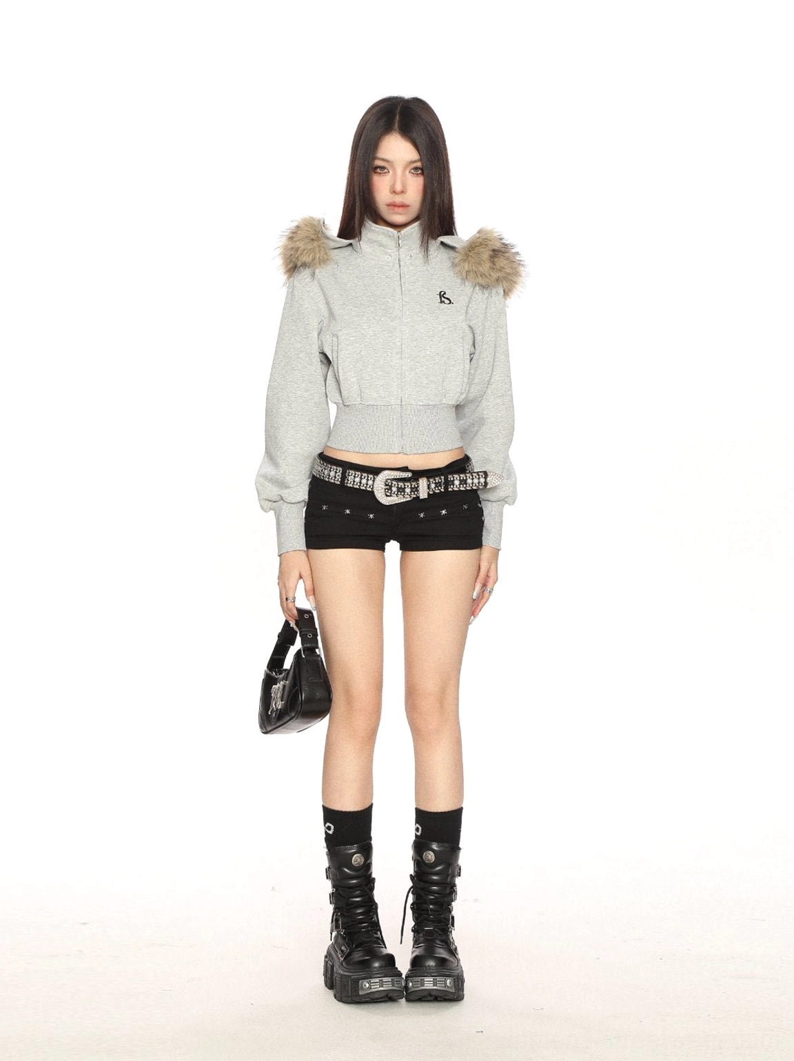 Full-body gray cropped zip-up sweatshirt with faux-fur hood detail styled as y2k streetwear with platform boots