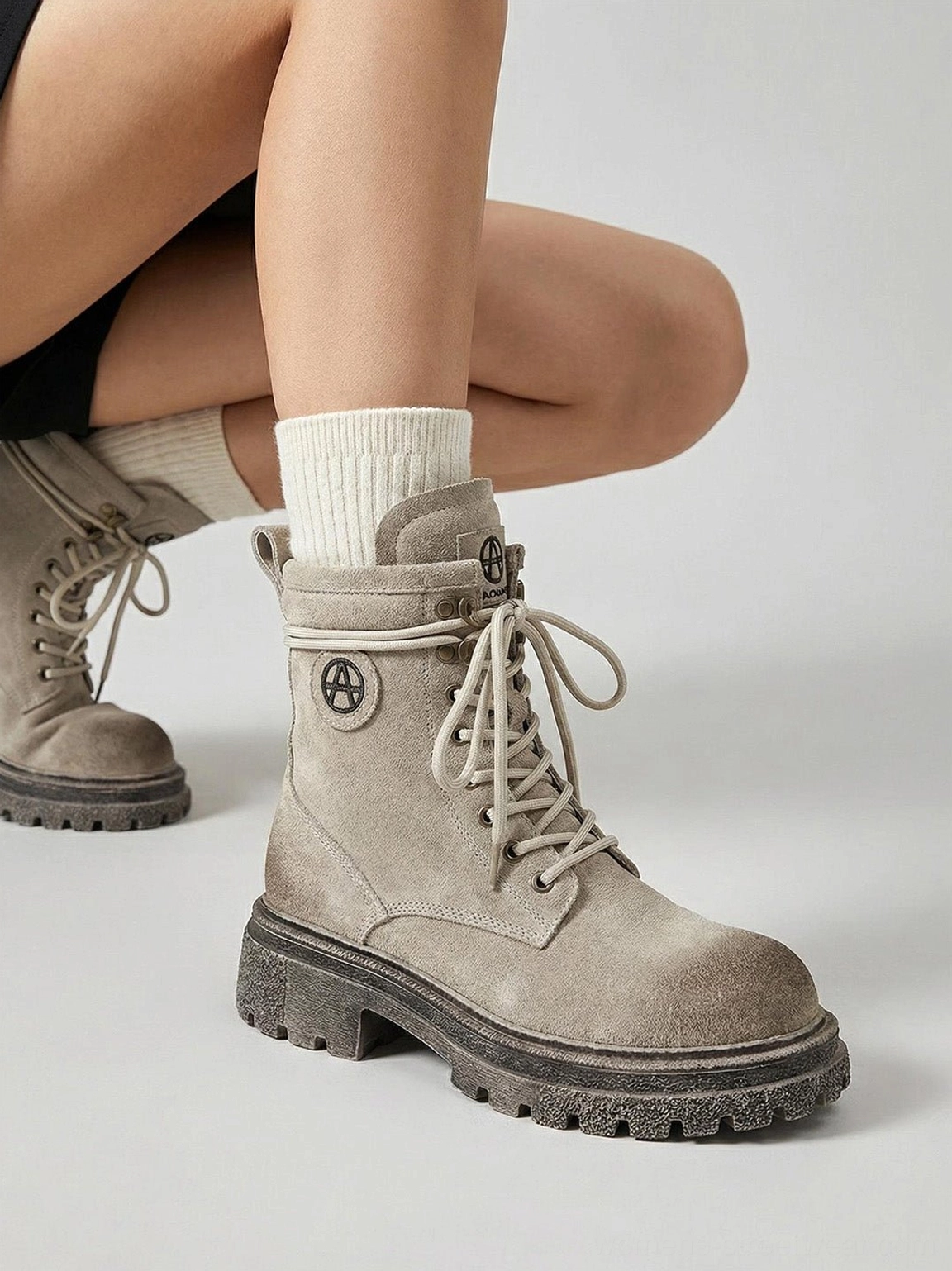 Gray distressed combat boots back view showing rear collar heel counter distressed weathered suede finish aged appearance
