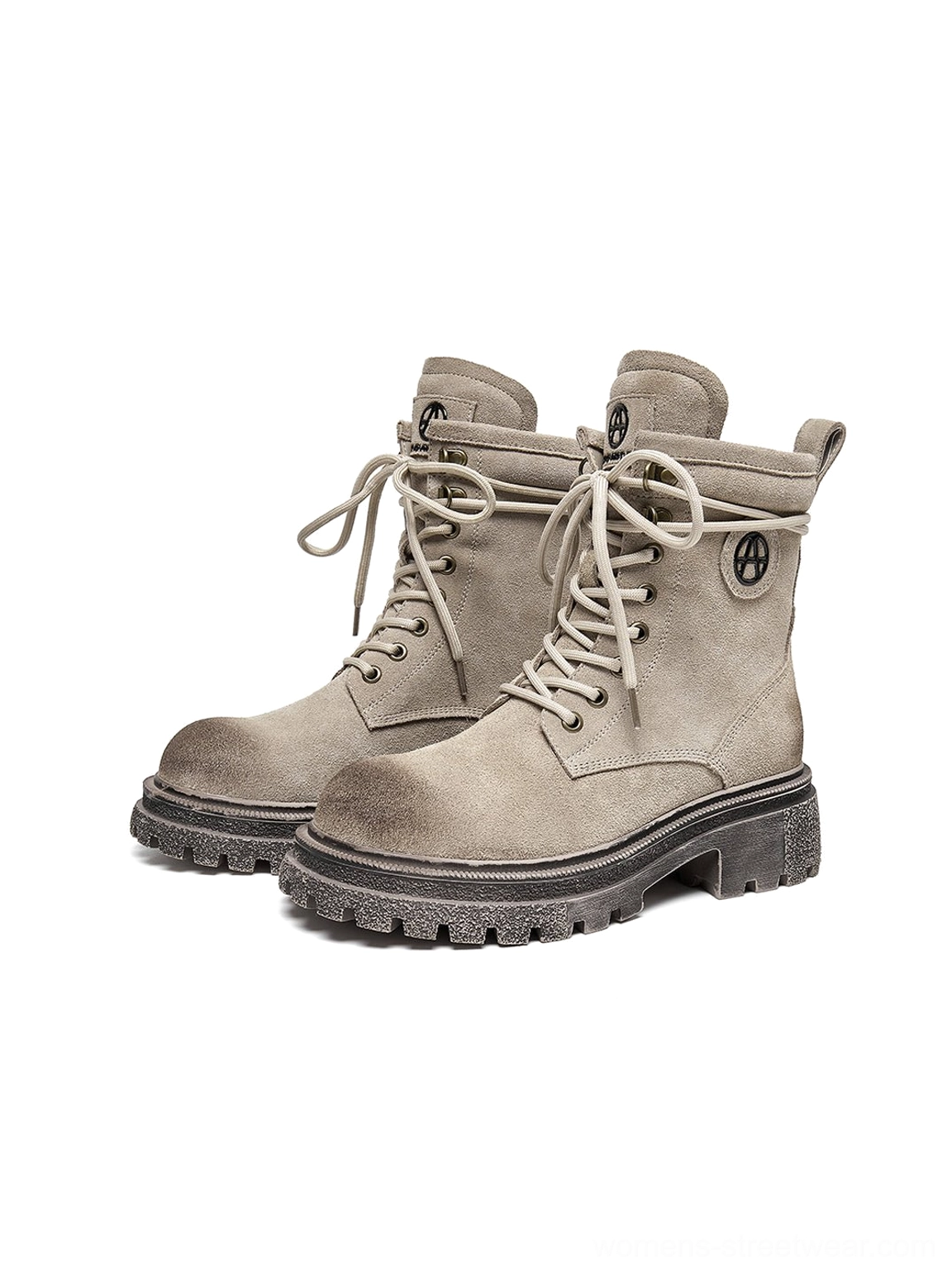 Gray distressed combat boots foot forward view emphasizing platform height architectural sole design presence
