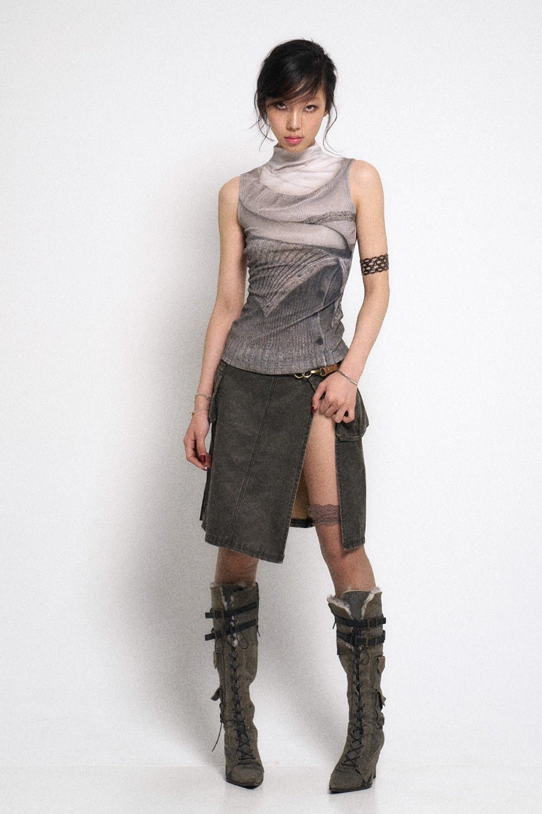 Gray distressed utility cargo mini skirt with asymmetrical hem side split and low rise streetwear fit