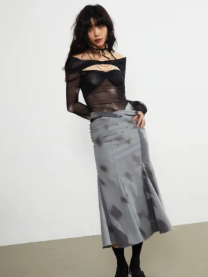 Gray embellished fishtail midi skirt with abstract dark watercolor print styled with a sheer black cropped top in a full front studio view